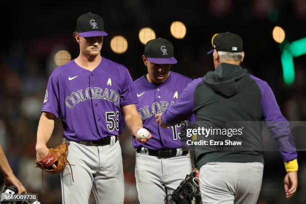 Evan Justice of the Colorado Rockies is taken out of the game by manager Bud Black in the eighth inning against the San Francisco Giantsat Oracle...