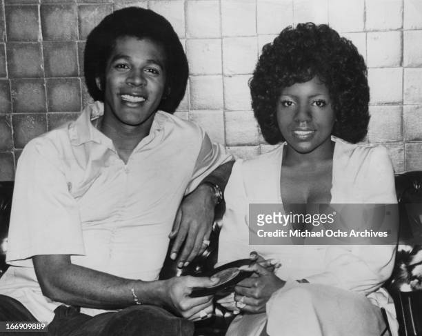 Disco queen Gloria Gaynor visits songwriter, musician and actor Clifton Davis on the set of his TV show 'That's My Mama' and hands him a copy of her...
