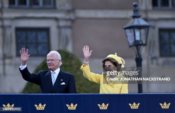 King Carl XVI Gustaf of Sweden and Queen Silvia of Sweden wave during festivities to celebrate the 50th anniversary of Sweden's King Carl XVI...