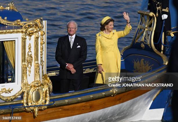 King Carl XVI Gustaf of Sweden and Queen Silvia of Sweden stand on a royal boat during festivities to celebrate the 50th anniversary of Sweden's King...