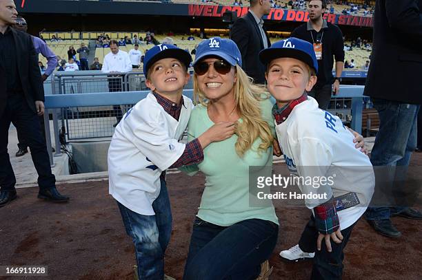 In this handout photo provided by the LA Dodgers, Britney Spears poses with sons Jayden James Federline and Sean Preston Federline during a game...