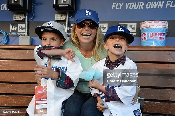 In this handout photo provided by the LA Dodgers, Britney Spears poses with sons Sean Preston Federline and Jayden James Federline during agame...
