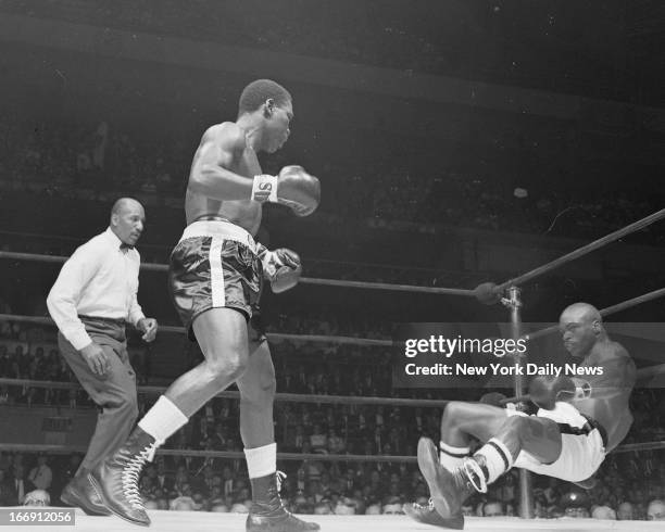 Rubin "Hurricane" Carter vs Dick Tiger at Madison Square Garden. Rubin Carter absorbing body punishment from opponent Dick Tiger, he was belted to...