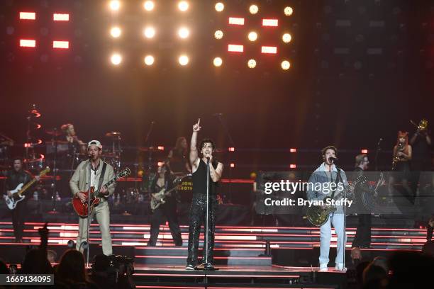 Nick Jonas, Joe Jonas and Kevin Jonas of Jonas Brothers perform during a stop of the group's Five Albums. One Night. The World Tour. At MGM Grand...