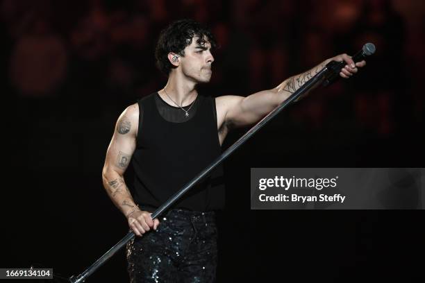 Musician Joe Jonas of Jonas Brothers performs during a stop of the group's Five Albums. One Night. The World Tour. At MGM Grand Garden Arena on...