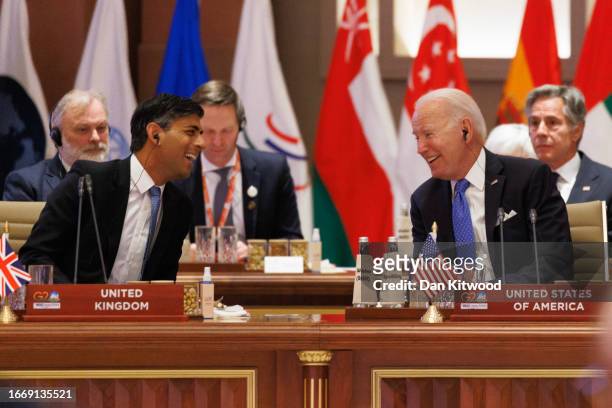 British Prime Minister Rishi Sunak speaks to US President Joe Biden during the G20 Leaders' Summit on September 9, 2023 in New Delhi, Delhi. This...