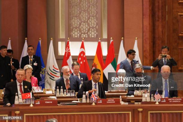 Recep Tayyip Erdoğan President of Turkey, L, British Prime Minister Rishi Sunak, C, and US President Joe Biden listen during opening session of the...