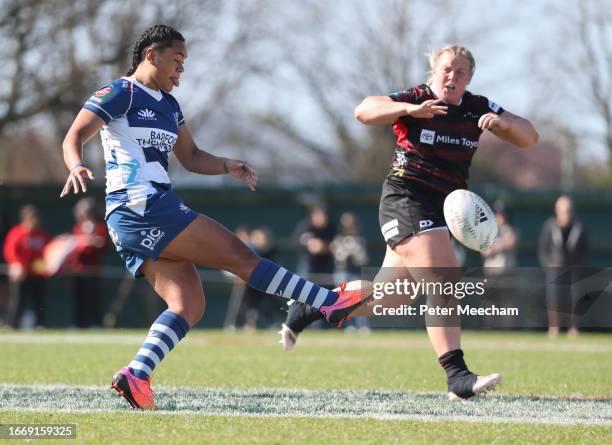 Patricia Maleipo of Auckland kicks past Pip Love of Canterbury during the Farah Palmer Cup Premiership Final match between Canterbury and Auckland at...