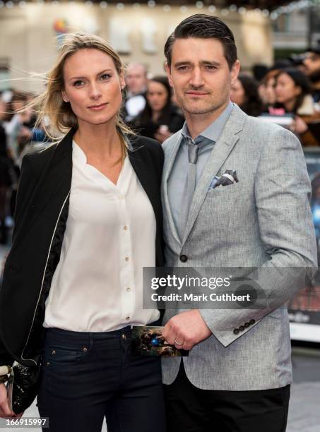 Tom Chambers and Clare Harding attend a special screening of 'Iron Man 3' at Odeon Leicester Square on April 18, 2013 in London, England.