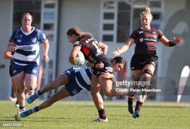 Amy Du Plessis of Canterbury is tackled by Braxton Sorensen-McGee of Auckland during the Farah Palmer Cup Premiership Final match between Canterbury...