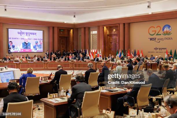 Recep Tayyip Erdoğan President of Turkey, L, British Prime Minister Rishi Sunak, C, and US President Joe Biden listen as Prime Minister Narendra Modi...