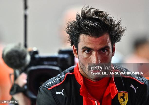 Ferrari's Spanish driver Carlos Sainz Jr looks on after the qualifying session of the Singapore Formula One Grand Prix night race at the Marina Bay...
