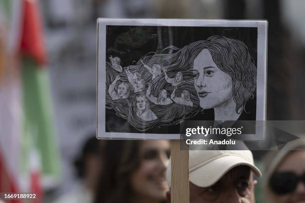Iranians stage a demonstration to mark the first death anniversary of Mahsa Amini, a 22-year-old woman who died in custody in Iran's Tehran after...