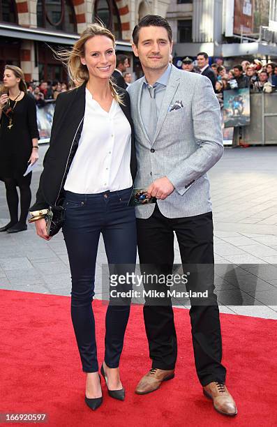 Tom Chambers and Clare Harding attend a special screening of 'Iron Man 3' at Odeon Leicester Square on April 18, 2013 in London, England.