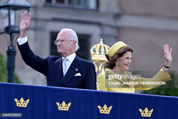 King Carl XVI Gustaf of Sweden and Queen Silvia of Sweden wave to the crowds during festivities to celebrate the 50th anniversary of King Carl XVI...