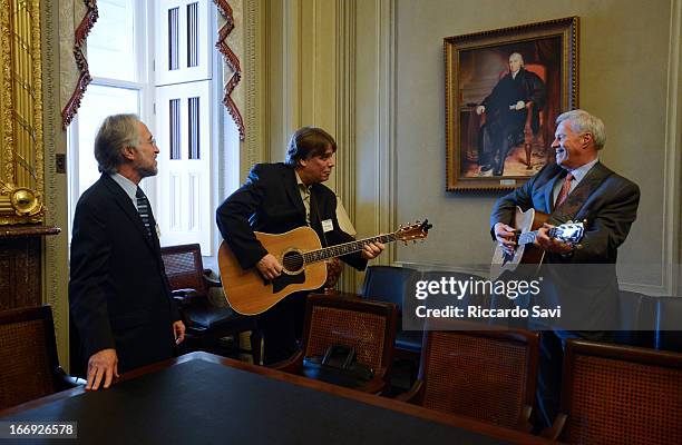 Neil Portnow listens to Collin Peterson and a member of the Recording Academy performing during GRAMMYs on the Hill/ Lobby Day on Capitol Hill on...