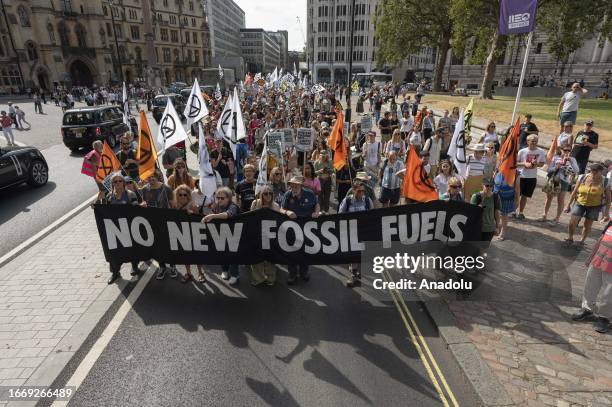 Climate activists stage a demonstration calling for an end to the use of fossil fuels for the 'Climate Summit Week' that will start before the...