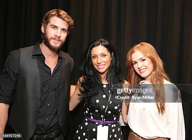 Actors Liam Hemsworth and Isla Fisher pose with guests prior to the Lionsgate CinemaCon Press Conference Invitational : An Exclusive Product...