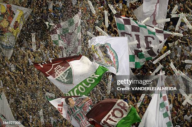 Brazil’s Fluminense fans celebrates during match against of Venezuela’s Caracas FC, during their 2013 Copa Libertadores football match held at Sao...