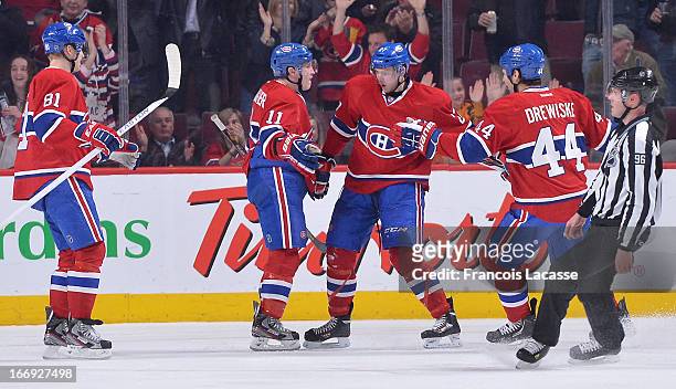 Alex Galchenyuk, Brendan Gallagher, Lars Eller and Davis Drewiske of the Montreal Canadiens celebrate a goal in the second period of NHL action...