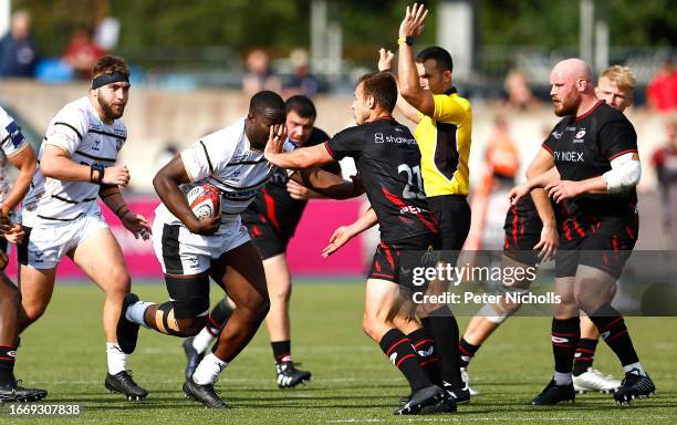 Lewis Ludlow of Gloucester in action with Ivan Van Zyl of Saracens in the Premiership Rugby Cup match between Saracens Men and Gloucester Rugby at...