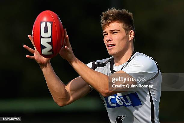 Josh Thomas of the Magpies marks during a Collingwood Magpies AFL training session at Olympic Park on April 19, 2013 in Melbourne, Australia.