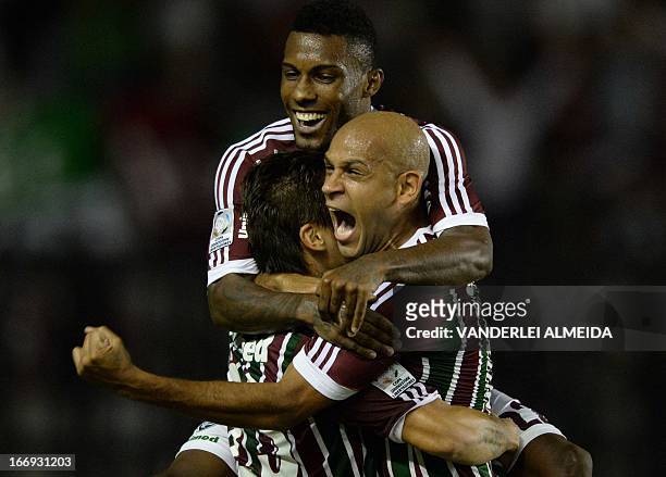 Rafael Sobis , Carlinhos and Rayner of Brazil’s Fluminense, celebrate their goal scored against Venezuela’s Caracas FC, during their 2013 Copa...