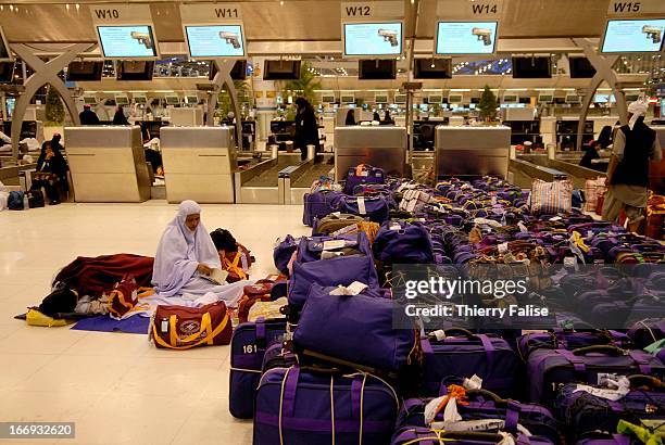 Thai Muslim pilgrims on their way to the Mecca are stranded at the Suvarnabhumi international airport in Bangkok after thousands of followers of the...