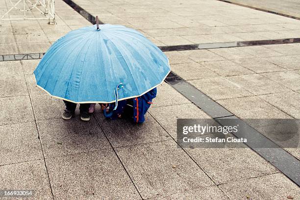 under umbrella | unfriendly weather - hautes pyrenees fotografías e imágenes de stock