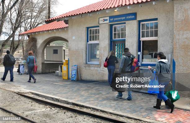 Train passengers enter the Amtrak station in Lamy, New Mexico, prior to boarding Amtrak's Southwest Chief. The train runs daily between Los Angeles...