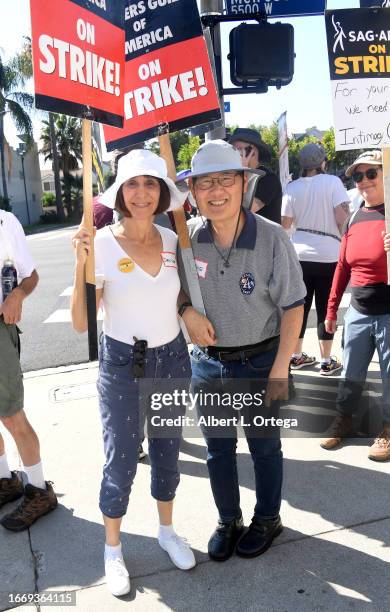 Denise Okuda and Michael Okuda join the United We Trek picket line outside Paramount Studios on September 08, 2023 in Los Angeles, California....