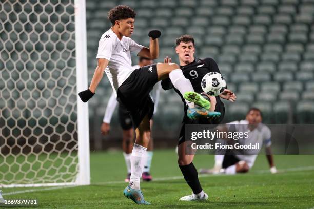 Riley Bidois of New Zealand tackles Sterling Vasconcellos of Fiji during the OFC Men's Olympic Qualifier Final match between New Zealand and Fiji at...