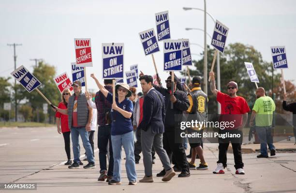 United Auto Workers members strike at the Ford Michigan Assembly Plant on September 16, 2023 in Wayne, Michigan. This is the first time in history...