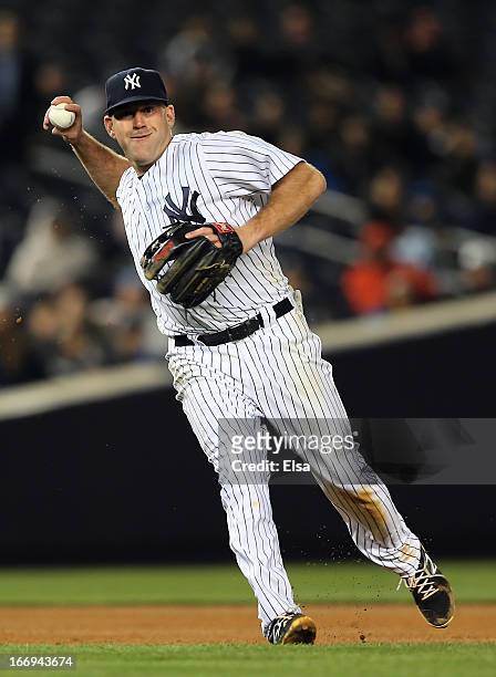 Kevin Youkilis of the New York Yankees sends the ball to first for the out against the Arizona Diamondbacks on April 18, 2013 at Yankee Stadium in...