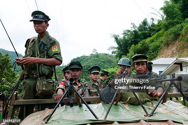 Soldiers from the Kachin Independence Army coming back from the frontline stop on a street in Laiza. With 6,000 troops, the KIA is one of the best...