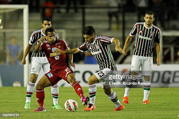 Rafael Sóbis of Fluminense fights for the ball with Romulo Otero of Caracas FC during the match between Fluminense and Caracas as part of Copa...