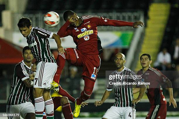 Fernando Cabezas of Caracas jumps for the ball with Jean of Fluminense during the match between Fluminense and Caracas as part of Copa Bridgestone...