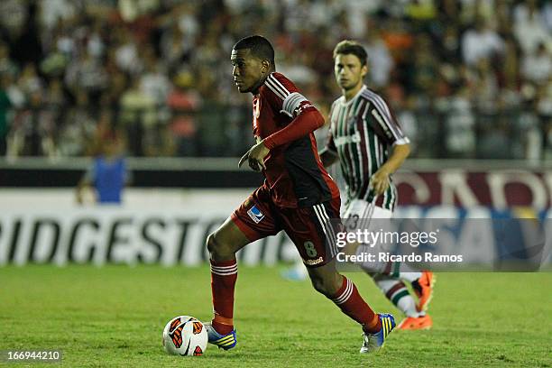 Edgar Jiménez of Caracas fights for the ball with Rafael Sobis of Fluminense during the match between Fluminense and Caracas as part of Copa...