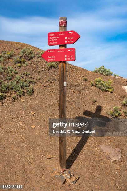 typical trail sign for the cami de cavalls coastal trail, minorca - cavalls stock pictures, royalty-free photos & images