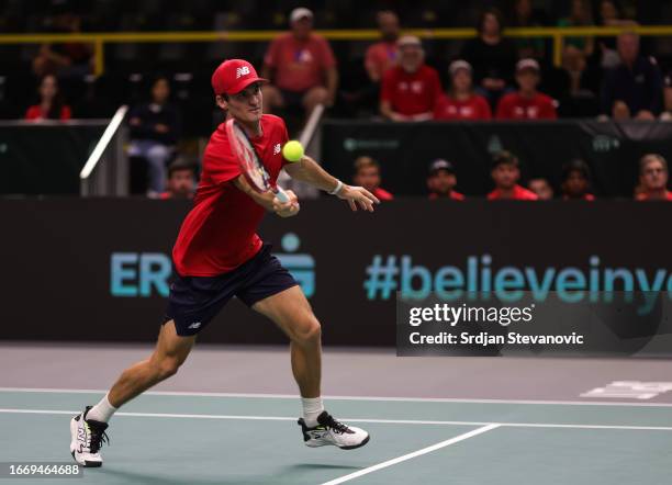 Tommy Paul of the United States returns the ball to Emil Ruusuvuori of Finland during the 2023 Davis Cup Finals Group D Stage match between United...