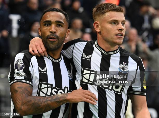 Newcastle United's English striker Callum Wilson and Newcastle United's English midfielder Harvey Barnes react after Wilson's goal was disallowed,...