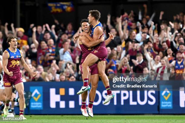 Zac Bailey of the Lions celebrates with team mate Cam Rayner after kicking a goal during the Second Qualifying Final AFL match between the Brisbane...