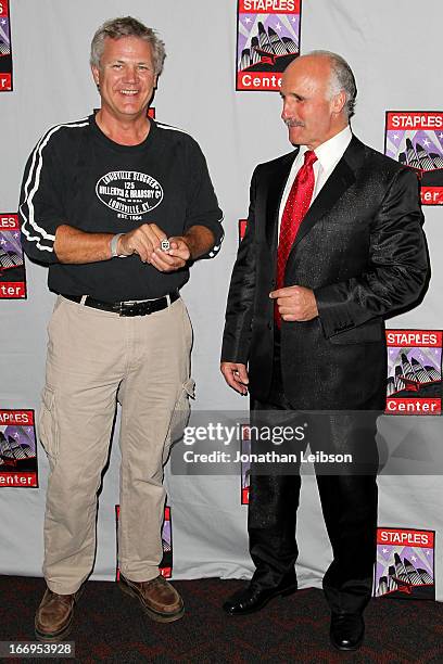 Daryl Evans poses with guests at the LA Kings Chalk Talk & Game Experience at Staples Center on April 18, 2013 in Los Angeles, California.