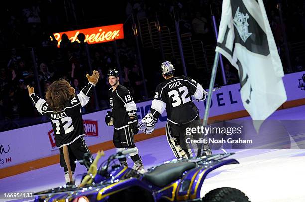 Kyle Clifford, Jonathan Quick and mascot Bailey of the Los Angeles Kings acknowledge the crowd after defeating the Columbus Blue Jackets at Staples...
