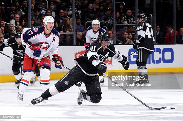 Anze Kopitar of the Los Angeles Kings reaches for the puck against the Columbus Blue Jackets at Staples Center on April 18, 2013 in Los Angeles,...