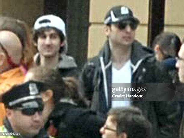 In this image released by the Federal Bureau of Investigation on April 19 two suspects in the Boston Marathon bombing walk near the marathon finish...
