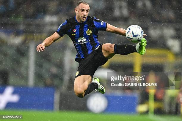 Inter Milan's Brazilian defender Carlos Augusto controls the ball during the Italian Serie A football match between Inter Milan and AC Milan at the...
