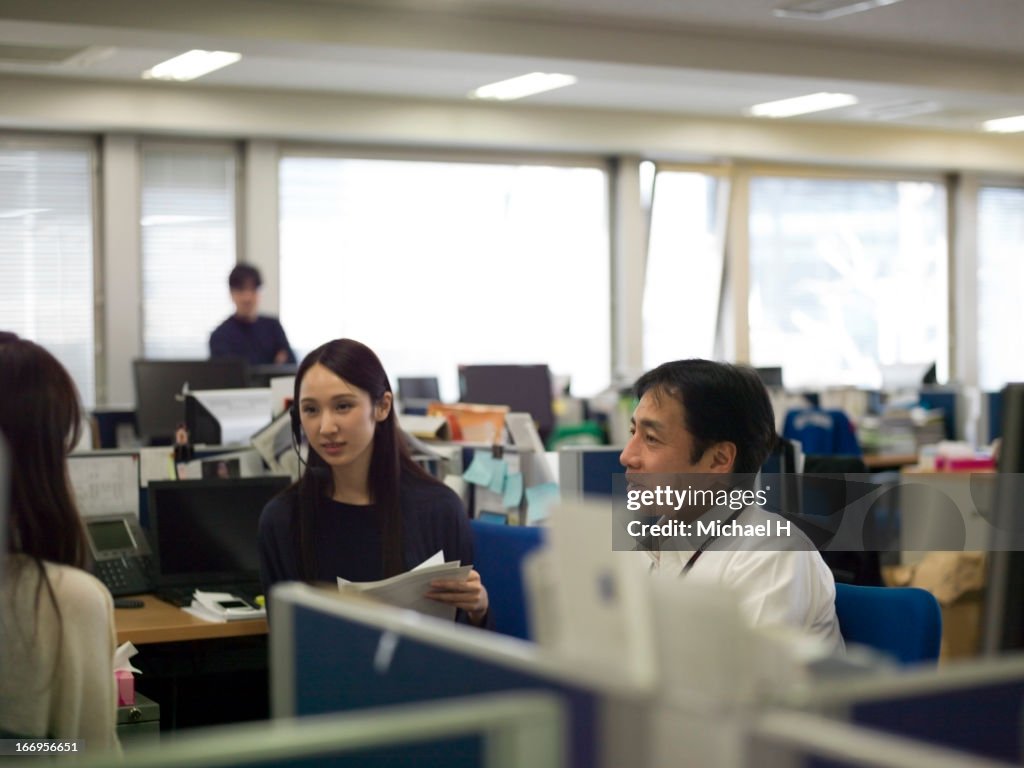 Three people having a meeting