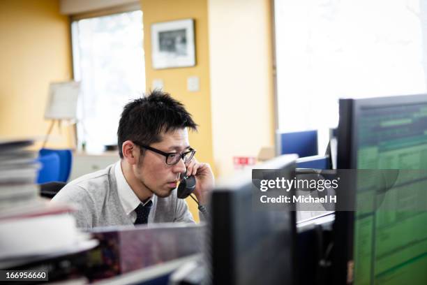 businessman talking on the phone in office - overworked man stock pictures, royalty-free photos & images