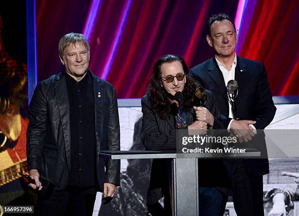 Inductees Alex Lifeson, Geddy Lee and Neil Peart of Rush speak on stage at the 28th Annual Rock and Roll Hall of Fame Induction Ceremony at Nokia...